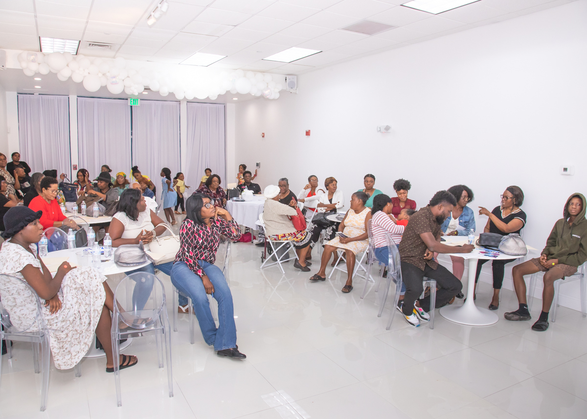 Parents seated at tables during the Extreme Heat Training session